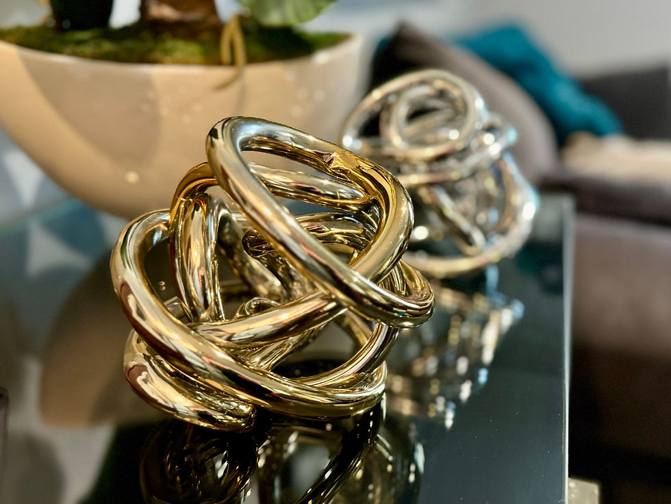 Thumbnail: gold metallic glass knot sculpture