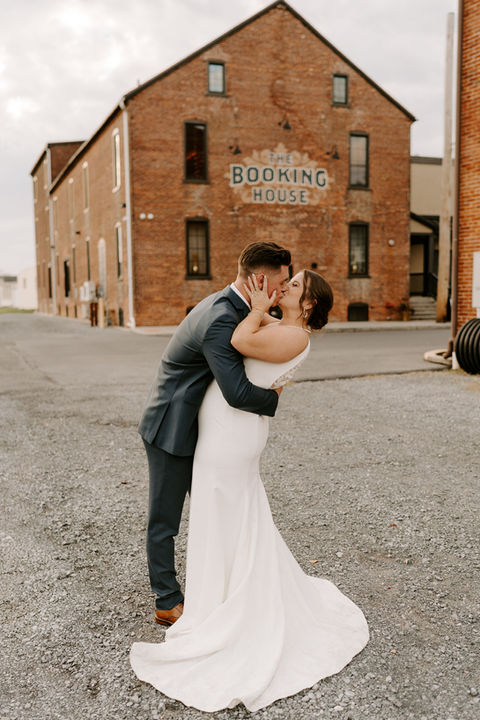Couple kissing outside The Booking House
