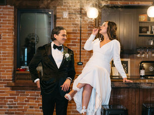 “Bride and groom enjoying a celebratory cigar in The Crow’s Nest, the private wedding cigar lounge at The Booking House in Lancaster County, PA.”