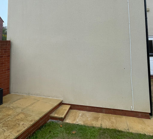Light coloured render after it's been chemically cleaned in Gloucester