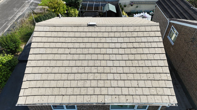 Modern flat tile roof after it's had the moss removed and been cleaned in Cricklade