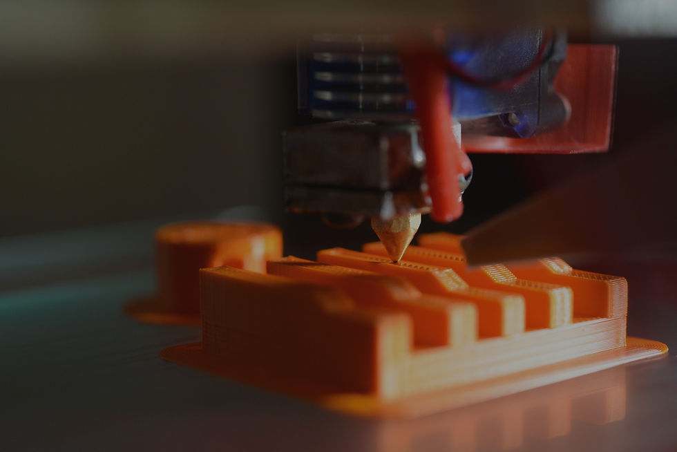 The hot-end of a Mendel90 RepRap 3D printer in action_edited.jpg