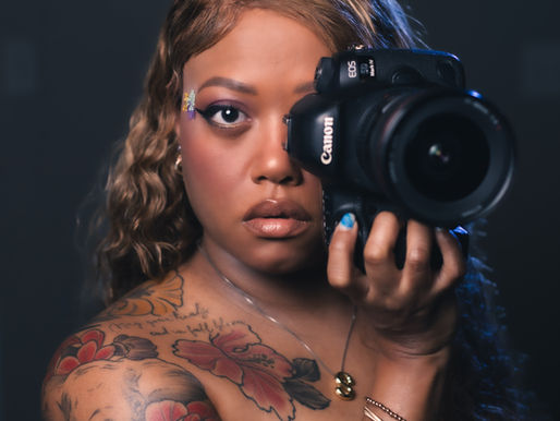 Sharvon Hales photographer holding a camera