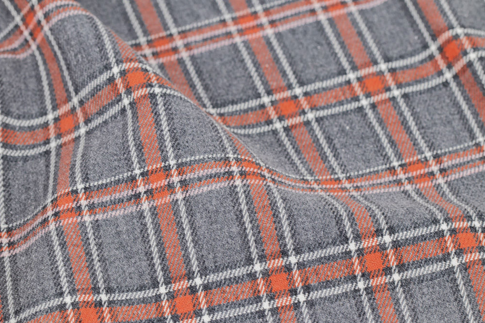Coton à carreaux roux sur fond gris       x 25 cm