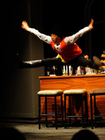 student jumping in air during anastasia musical