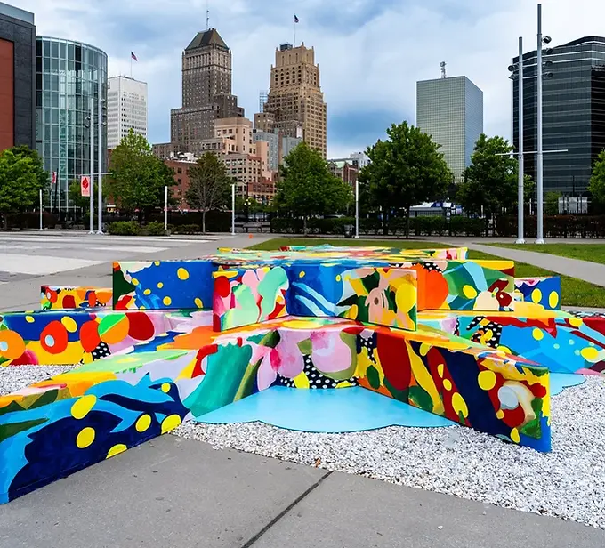 Newark Grounds is a walkable cultural corridor in Downtown Newark, New Jersey, featuring almost 100 consecutive public artworks and dedicated arts and culture spaces.
Led by Project for Empty Space, this initiative is a collaboration with the City of Newark Division of Art and Cultural Affairs, the City of Newark Arts and Education District, Newark City Parks Foundation, Newark Alliance, Newark Happening, Newark Downtown District, Newark Arts, Four Corners Public Arts Partnership, and the Rutgers University-Newark Design Consortium. The project connects Newark Penn Station to Teachers Village through a dynamic arts path.
The initiative bridges public art projects from Four Corners Public Arts, Project for Empty Space, and Gateways to Newark: Portraits, along with selected works from New Jersey Transit’s public art program at Newark Penn Station. It is strategically situated within the Arts and Education District, established by Mayor Ras J. Baraka in Fall 2022.