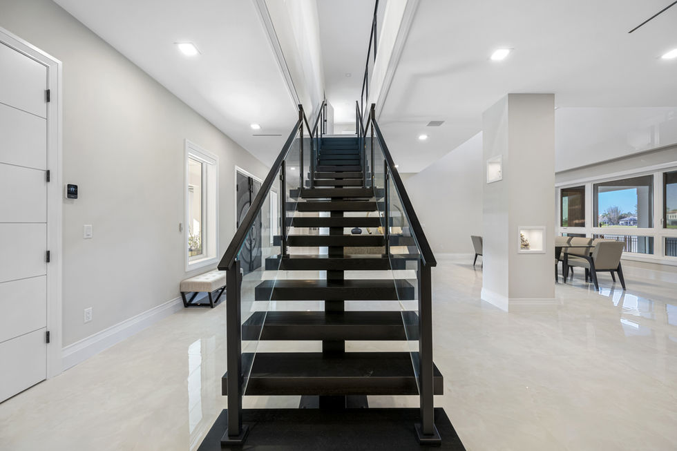 Modern staircase in a bright, minimalist interior.