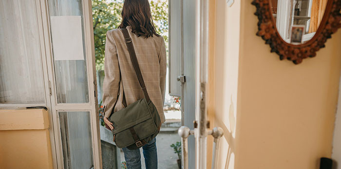 A Cheshire Pension Fund Member leaving their house to go to work