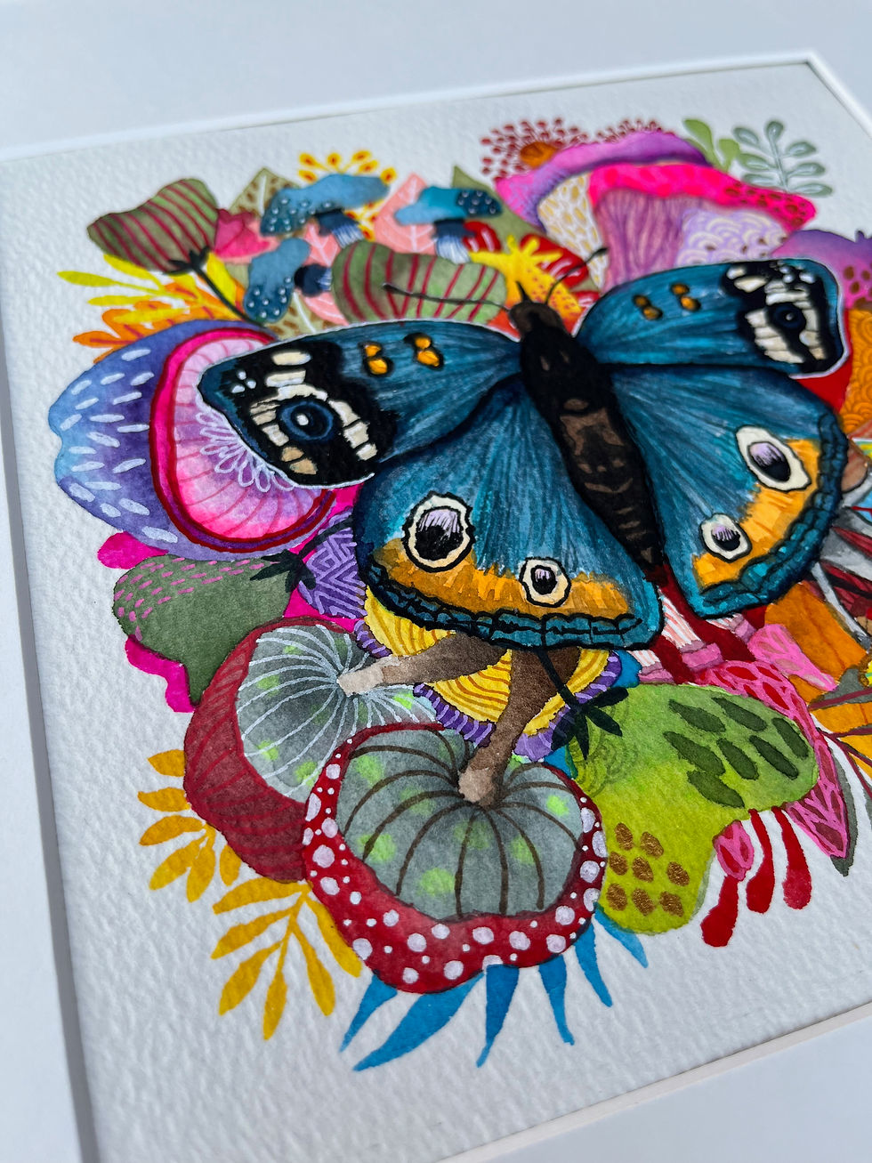 Thumbnail: Tableaux décoratifs papillon bleu et fleurs exotiques, œuvre recherchée par collectionneurs d’art.