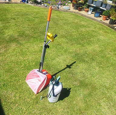 Professional pooper scooper tools and sanitising equipment used for dog waste removal services in Bangor and North Down.