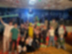 Group of YP looking at camera on dance floor.jpeg