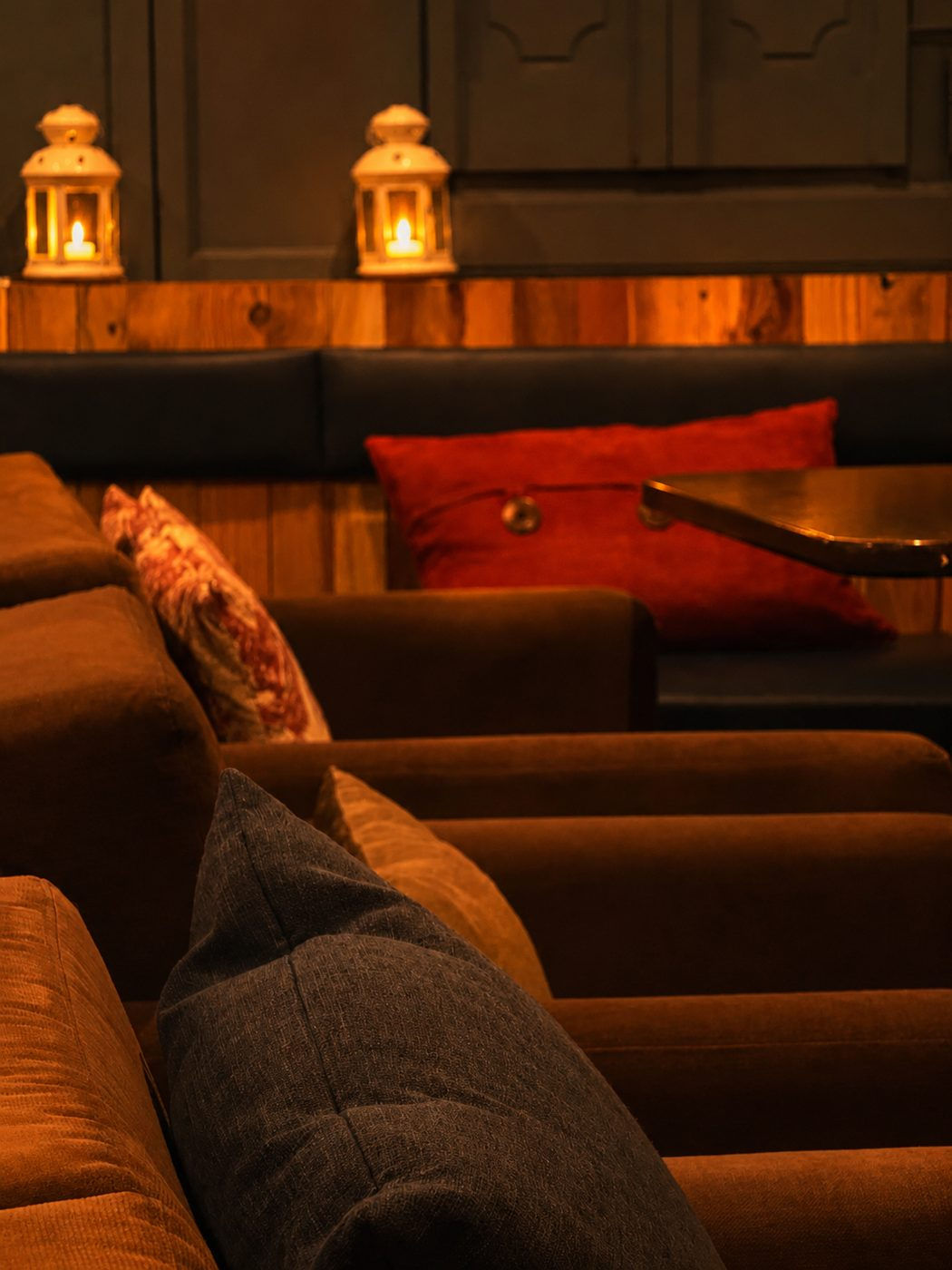 Lanterns and low amber light over the lounge seating at Aromas Cafe by 7Spices in Windsor, Ontario