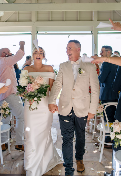 Ceremony aisle exit with confetti