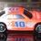 Thumbnail: e and orange 1:64 scale chevy lumina w/blue and white lettering/trimwhit