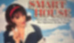 VHS cover of Smart House (1999) featuring Pat the AI in 1950s attire with the tagline 'When The Computer At Home Has Opinions Of Her Own!' against a backdrop of a futuristic house and blue sky. Analysis by Madison Enis, The Linguist Lens