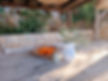 Outdoor dining with weathered wood table and oranges