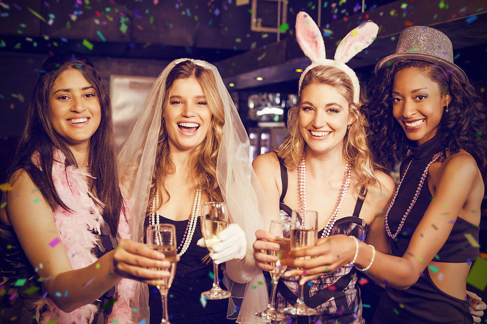 Young women sitting in the limo at theit bachelorette
