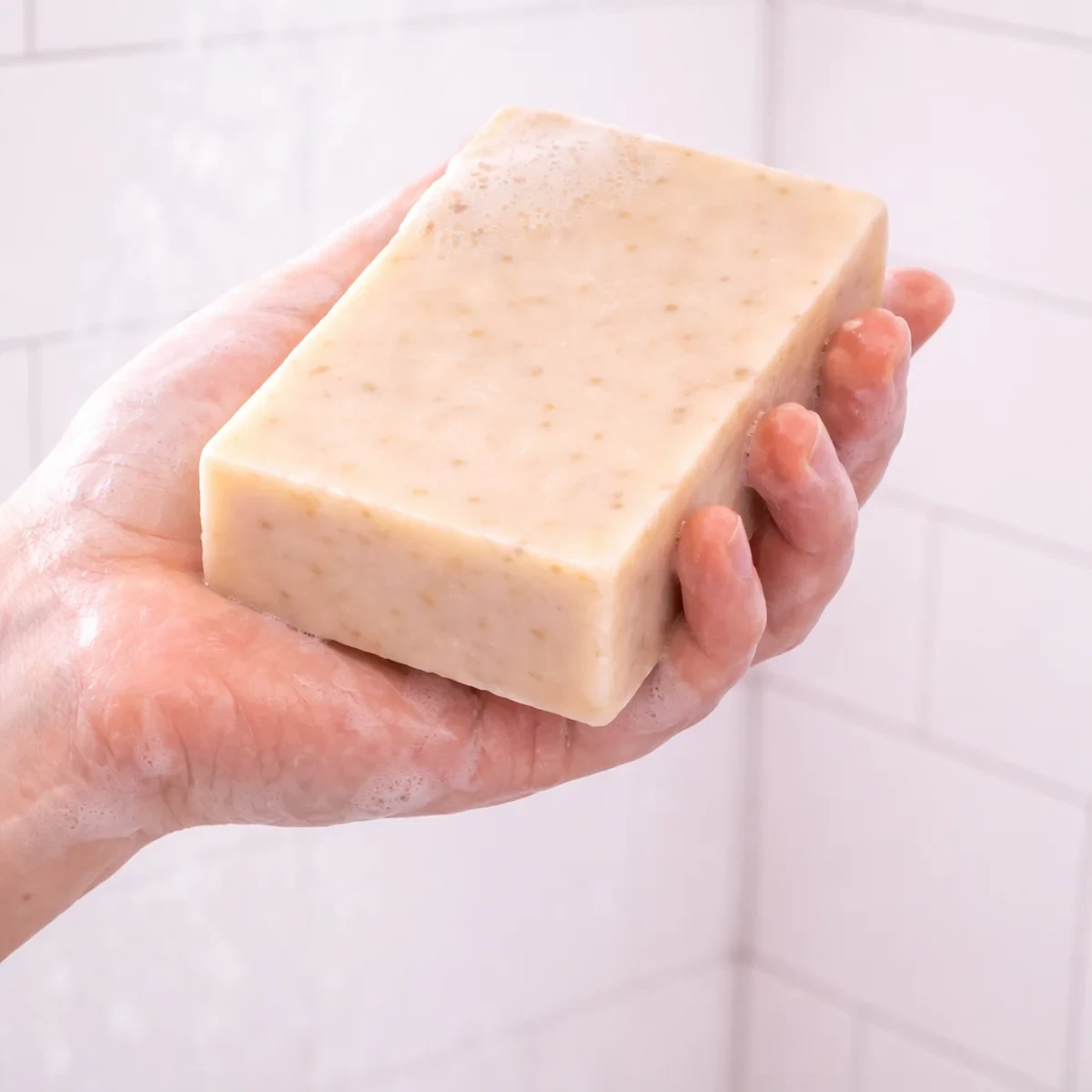 Dulce Avena Bar Soap — single bar shown in use