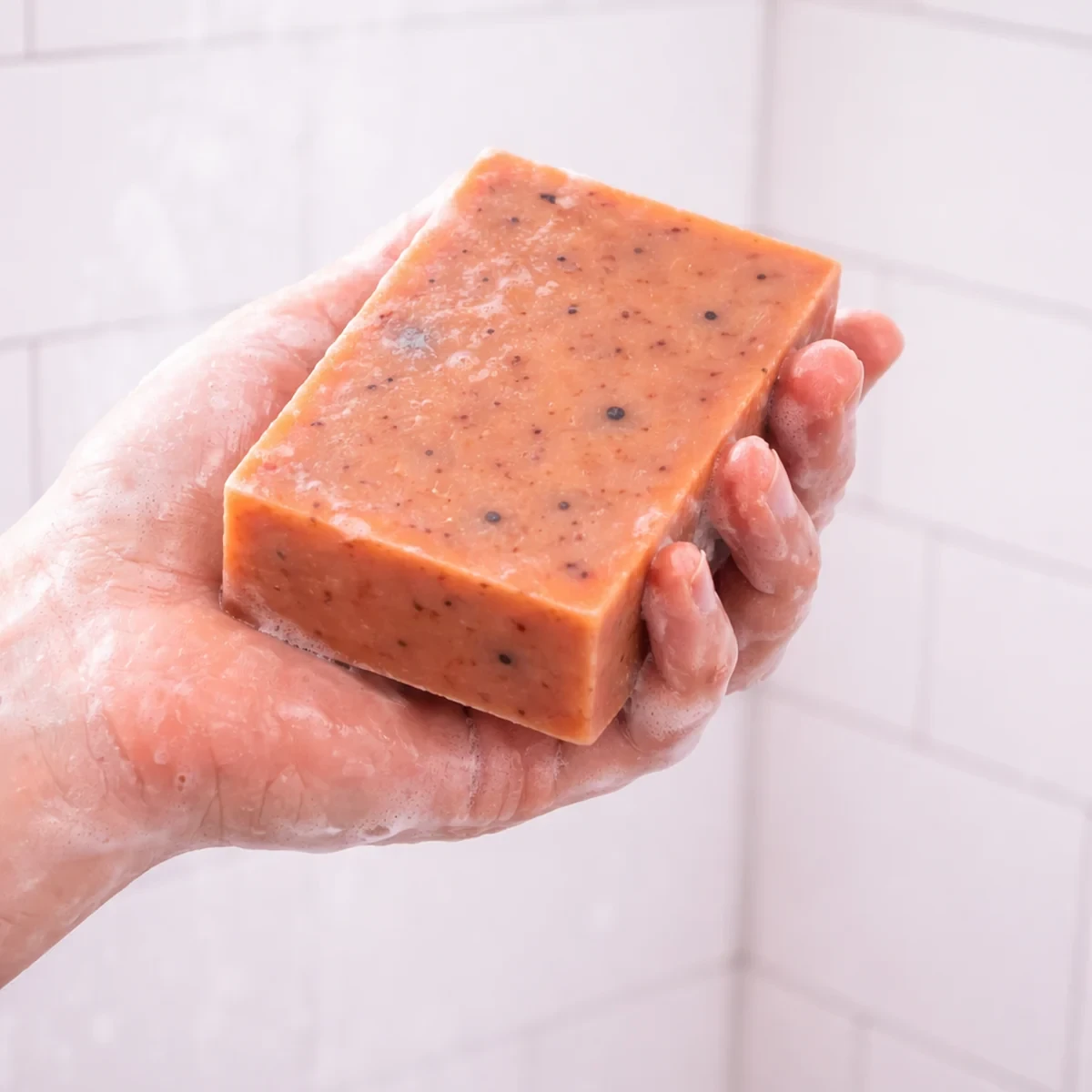 Rosa Nieve Bar Soap — single bar shown in use