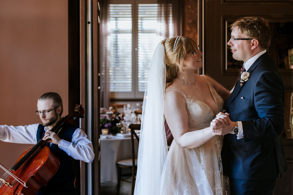 Eye-level view of a bride walking down a garden path with natural sunlight