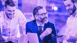 Colleagues discussing critical competencies for human oversight of AI