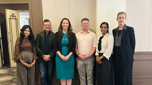 Six doctors standing in a line