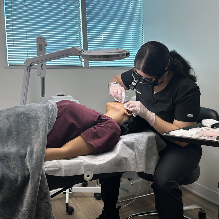 Acne Specialist performing extraction