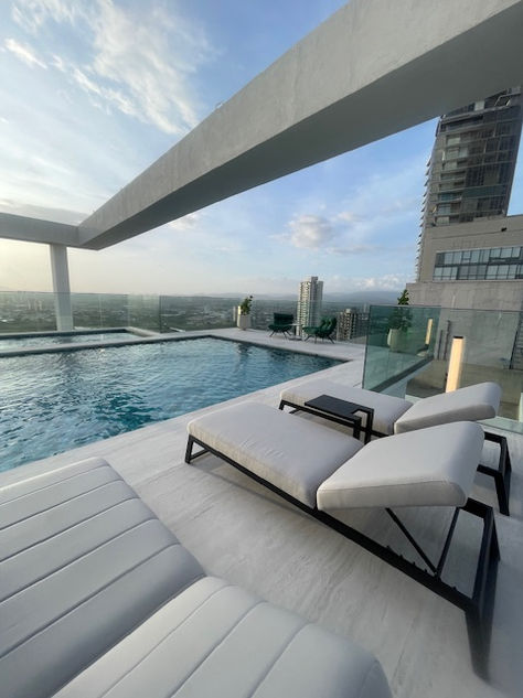 Photos of a modern 3-bedroom ocean-view apartment in Panama City, featuring spacious interiors, elegant finishes, private balcony, and premium amenities – listed by Ama Panama Realty.