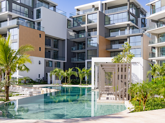 “Elegant oceanfront living room with floor-to-ceiling windows – The Palms Beach Resort Panama”