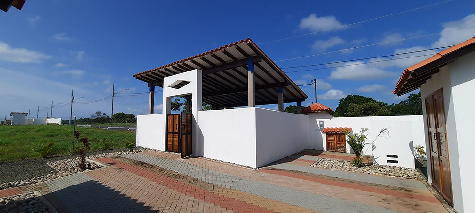 Modern minimalist tropical home for sale in Pedasí with covered terrace and large windows.