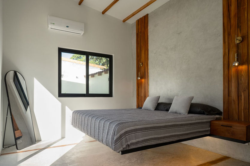 Bedroom in Villa Brisas with elegant tropical style and natural light