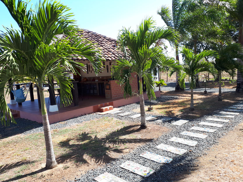 “Outdoor kitchen and dining lounge in social area – Pedasí multi-unit property”