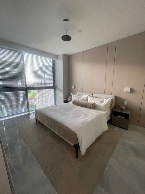 Photos of a modern 3-bedroom ocean-view apartment in Panama City, featuring spacious interiors, elegant finishes, private balcony, and premium amenities – listed by Ama Panama Realty.
