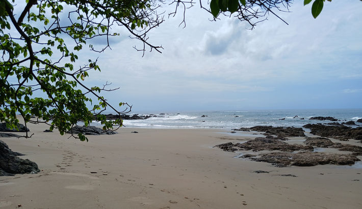 Wide view of wild undeveloped beach and tropical coastline at Playa Chumico, Pedasí.