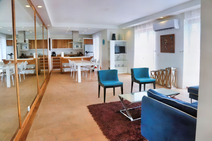 Open living room inside Esmeralda beachfront apartment in Pedasí