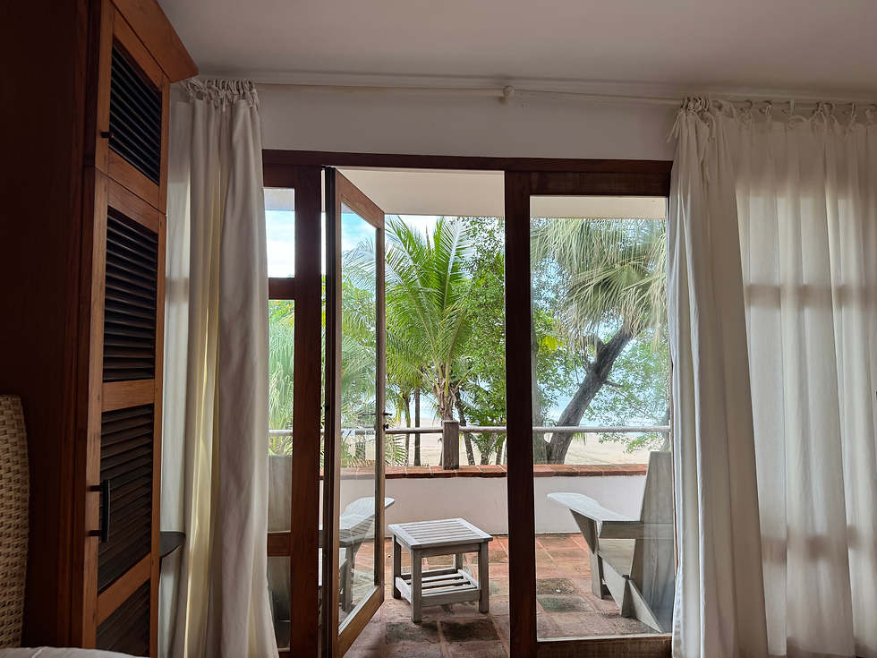 “Open-concept studio with custom tropical wood furniture designed by Gilles Saint-Gilles.”