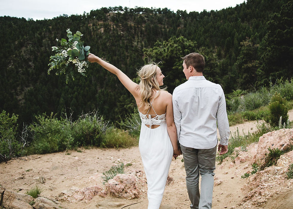 elopement couple on mountain top in colorado celebrate
