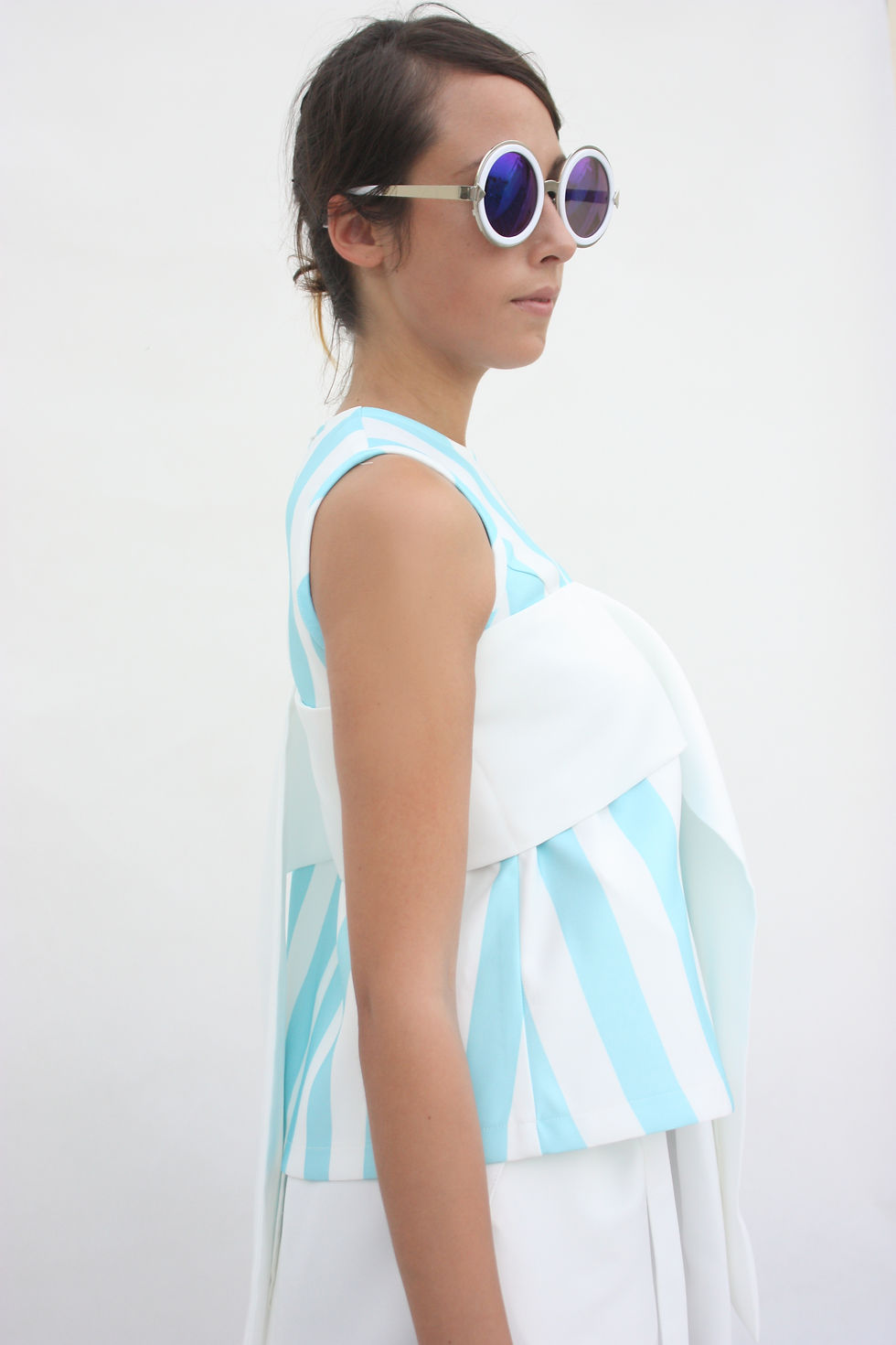 Sleeveless top with side gather