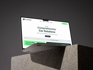 Angled view of a laptop displaying the homepage of RoadXpert's website, showcasing web development work for a comprehensive car solutions brand, including sections for accident management, car insurance, and vehicle financing.