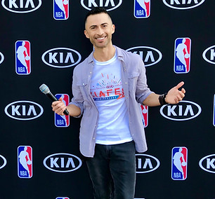 JC Rubio Professional Emcee and On-camera Host holding a mic