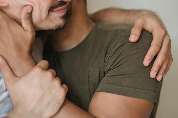 Two mens kissing toghether