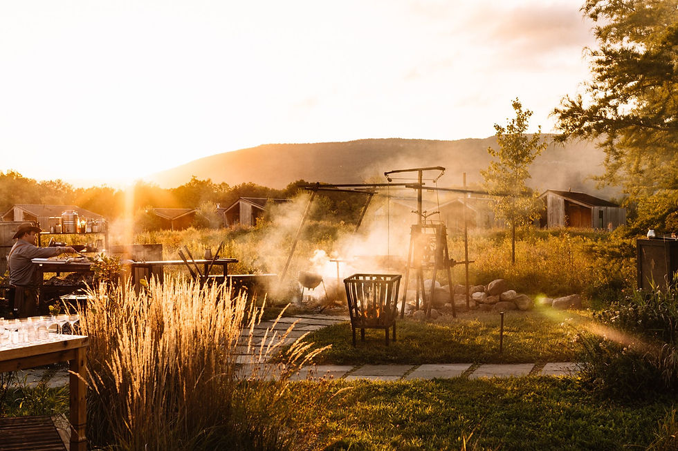 Temporary Heirloom Fire open-fire kitchen at sunset during a Wildflower Farms dinner, photograph by Noël McGrath.