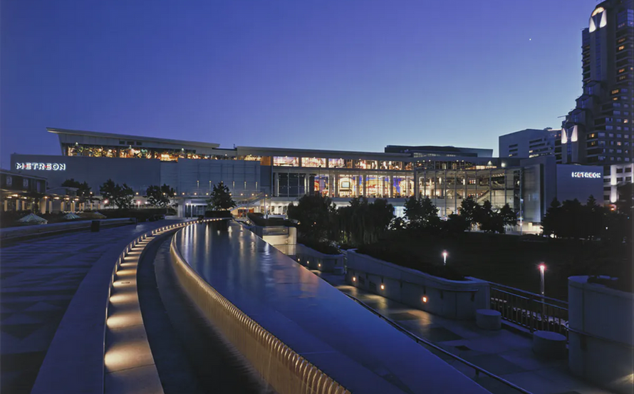 Evening view of fountains and buildings that make up the Westfield Metreon Mall that was redeveloped by Westfield development team including Trace Wilson