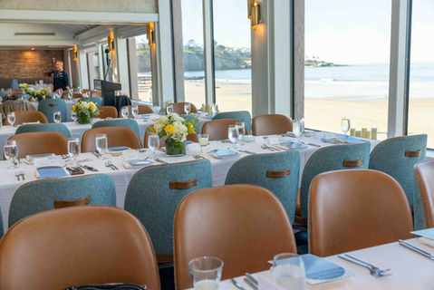 Elegantly set tables inside the Marine Room in La Jolla ready for the Las Patronas Beneficiary Luncheon.