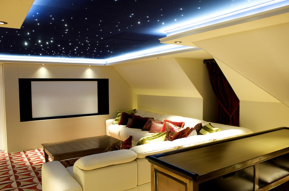 TAM2L motorised masking projection screen by Screen Excellence in a loft home cinema conversion