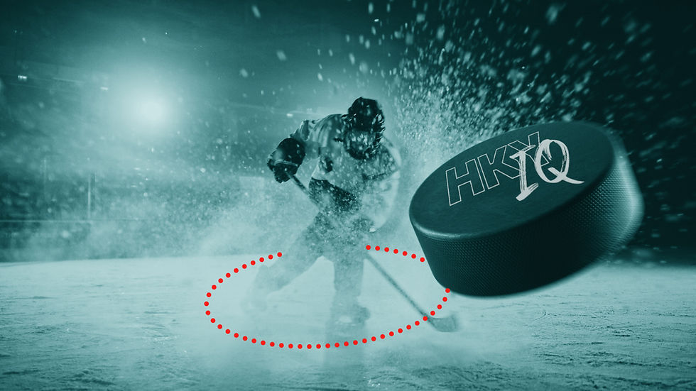 A highlighted player on the ice shooting a puck with the HKY-IQ logo towards the viewer .