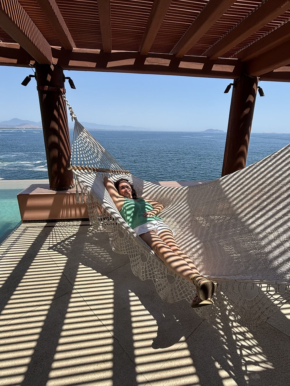Practicing Inner Joy relaxing in a hammock overlooking the Pacific