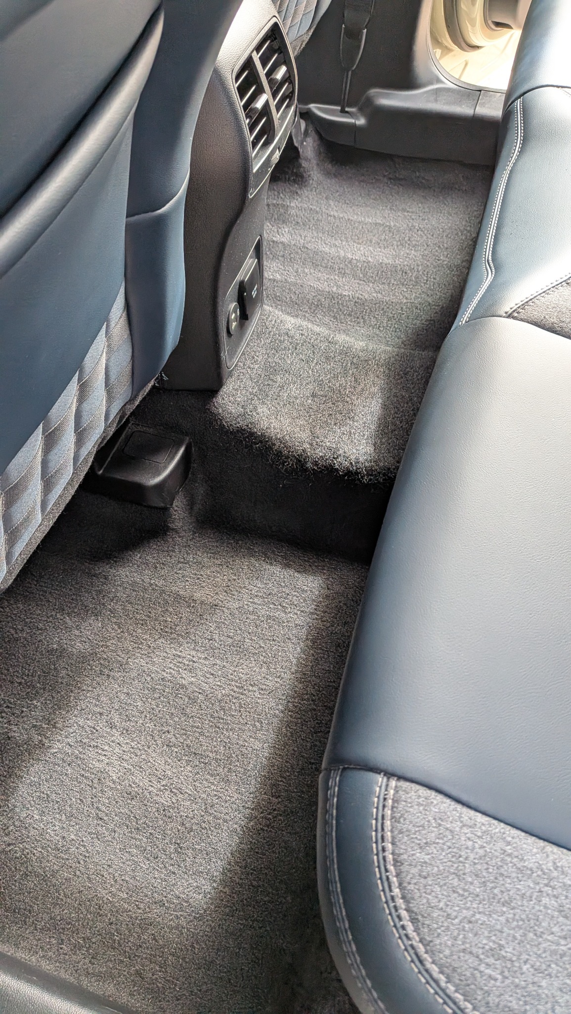 Clean rear vehicle carpet after detailing