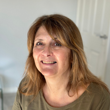 Tracy Cross a picture of a lady with shoulder length hair smiling