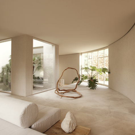 clean minimal and cozy lounge space at es raco literally just girls majorca retreat